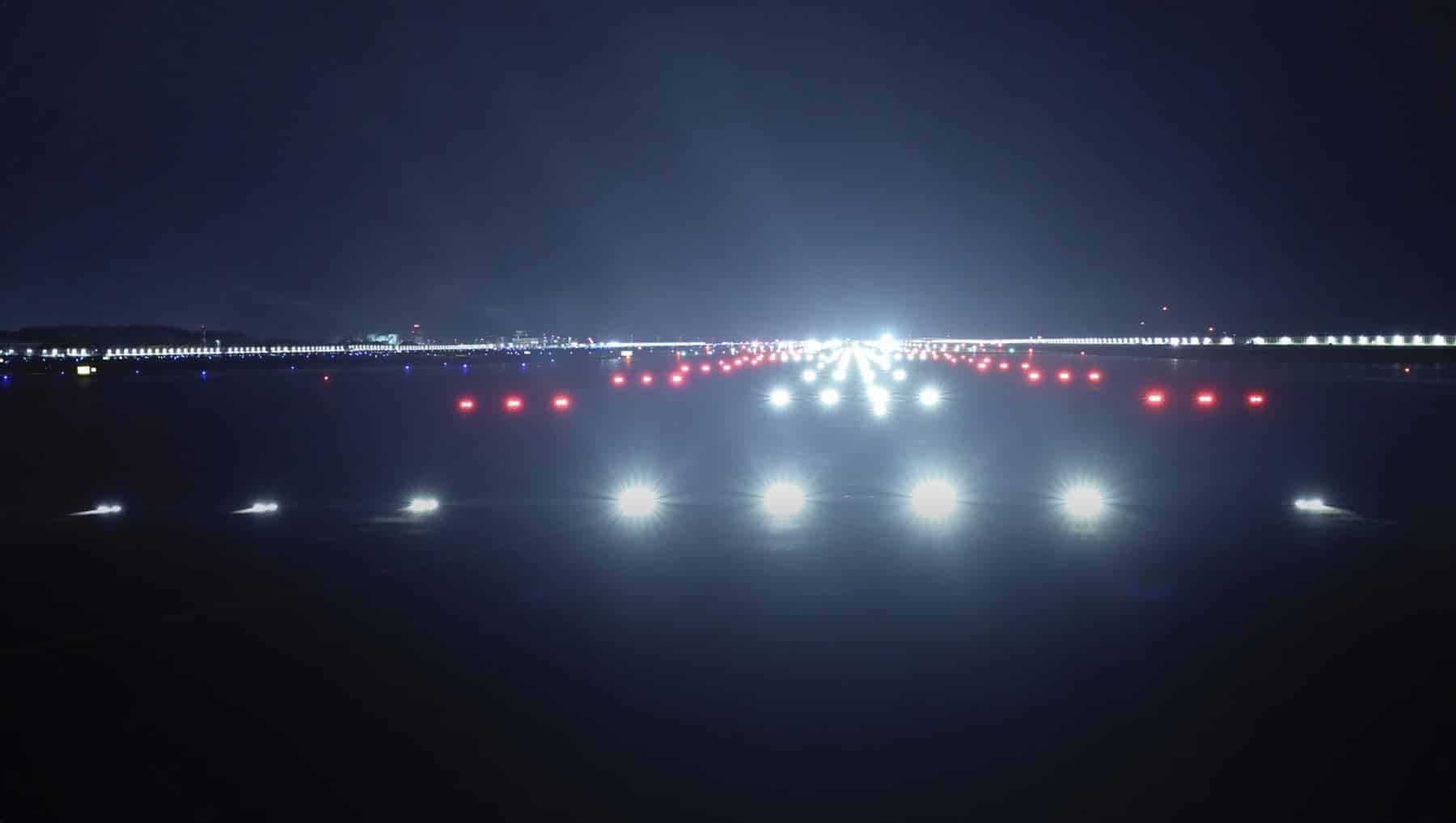 Visual Suspect crew filming on the runway at Hong Kong International Airport